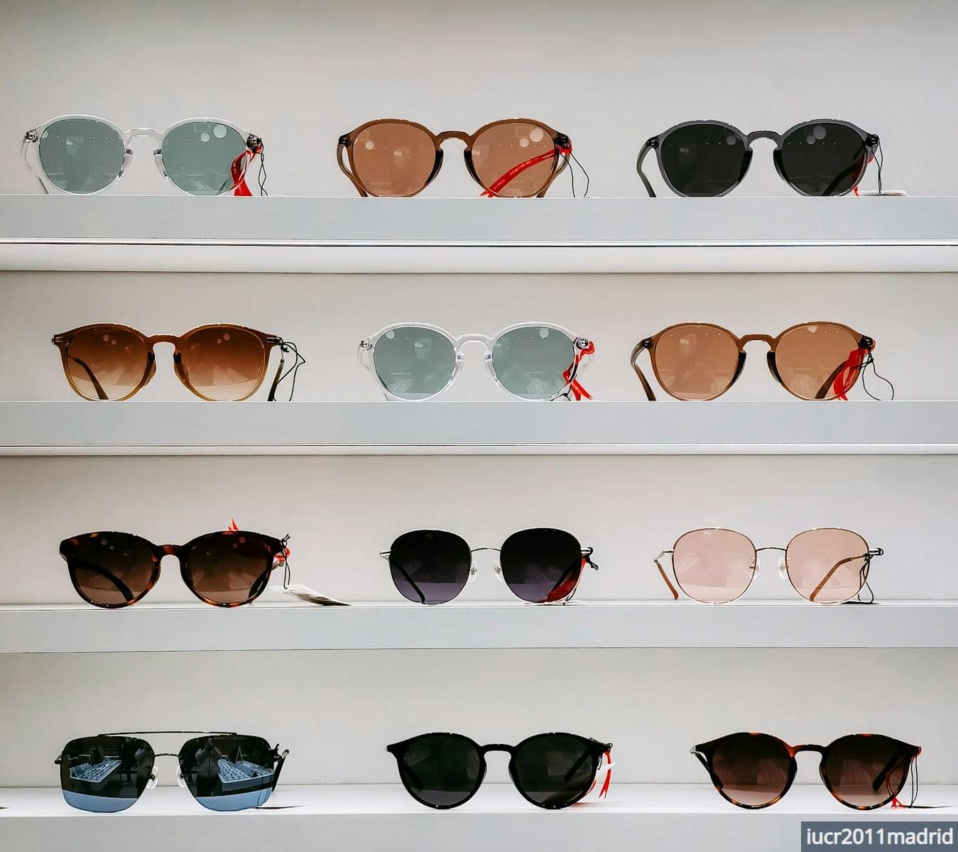 black framed sunglasses on white surface